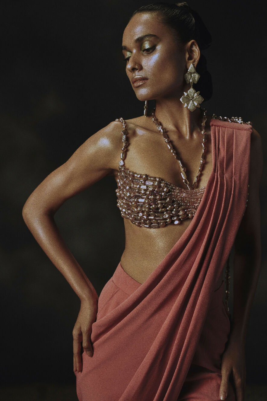 Woman wearing a traditional outfit with a dark background