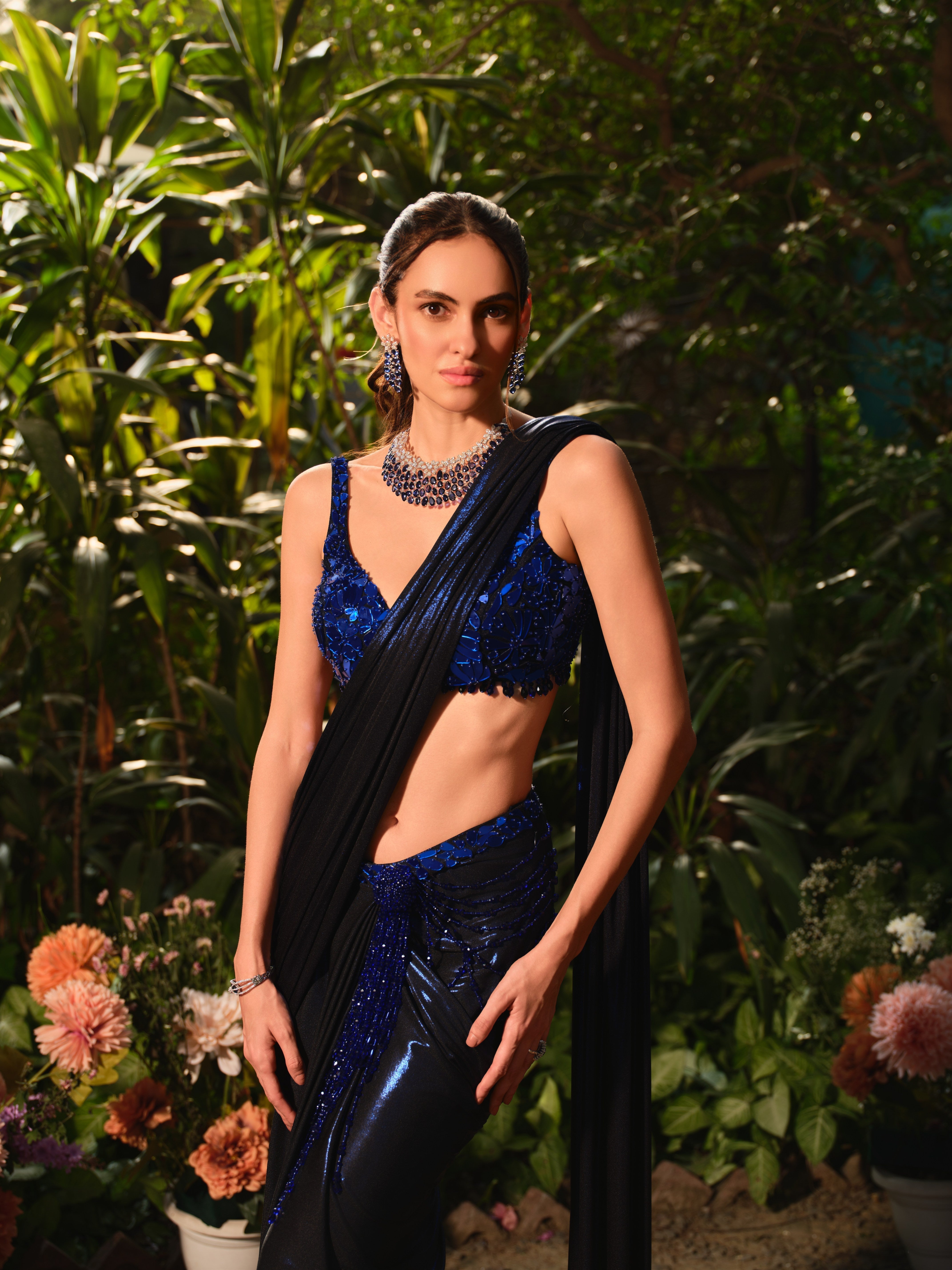 The beside her midnight blue saree set