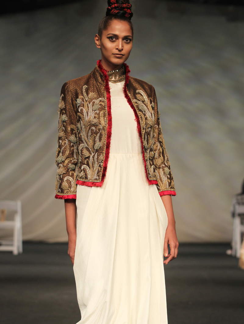 Timeless gold and red embroidered jacket with cream dress