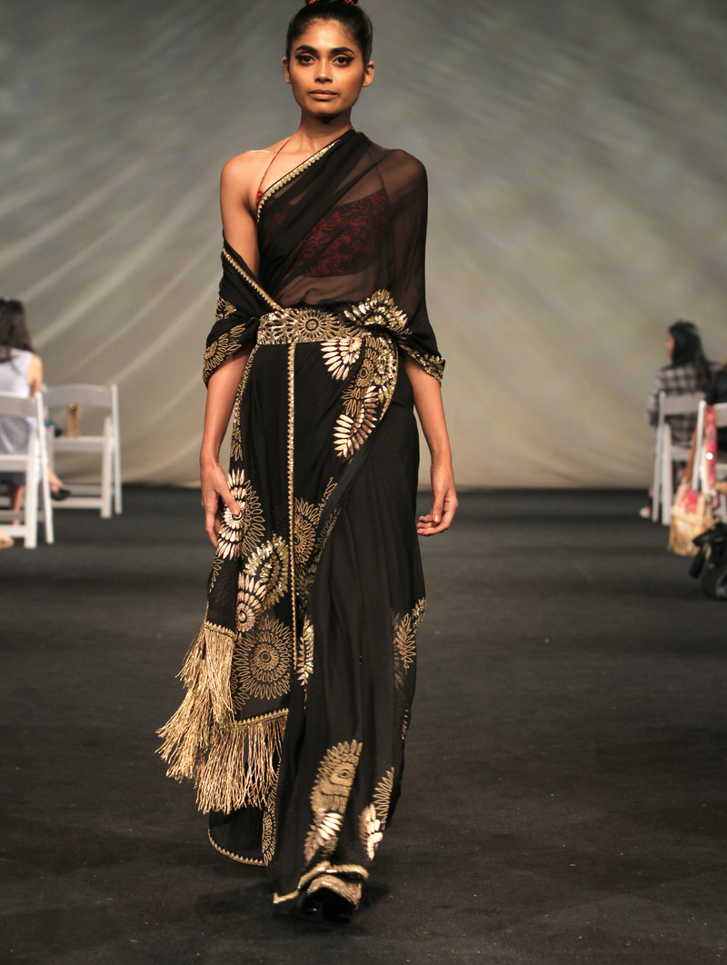 Black and gold draped Sari